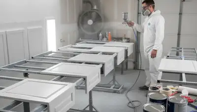 Professional cabinet painting in Kenosha WI using spray techniques for smooth, durable kitchen finishes