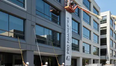 Professional commercial painters coating office exterior in Kenosha, WI for durable, weatherproof finish